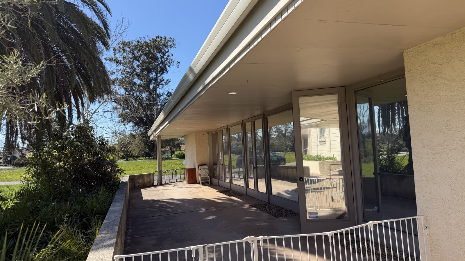 Covered patio along the glass wall of the Salaam Center